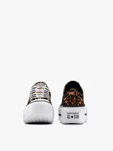 Championes Converse Chuck Taylor All Star Lift con estampado animal print en tonos marrón y negro. Plataforma blanca con línea negra.