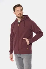 Canguro con cierre y capucha color bordó, confeccionado en felpa de algodón y poliéster.