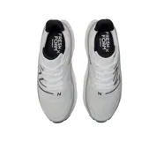Championes de running New Balance Fresh Foam X More v4, color blanco con detalles en negro y logo "N" en gris.