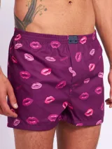 Bóxer de algodón blanco con estampado de flores pequeñas color celeste, con cintura elástica y logo de la marca en el centro.