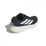 Championes Adidas Supernova Ease, color negro con detalles blancos, ideales para running.