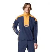 Campera cortaviento Columbia Riptide II Retro para hombre, color azul marino y amarillo mostaza. Diseño con media cremallera frontal, bolsillos laterales con cremallera, puños elásticos y dobladillo ajustable. Logo de Columbia bordado en el pecho y estampado en la manga.