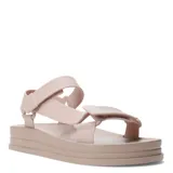 Sandalias planas color beige con plataforma y tiras con ajuste de velcro.