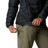 Campera puffer negra de Columbia, con cierre frontal, bolsillos laterales con cierre y logo de la marca bordado en el pecho.