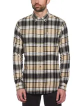 Camisa de franela a cuadros en tonos beige, negro y blanco. Tiene cuello abotonado, manga larga, bolsillo en el pecho y corte clásico.