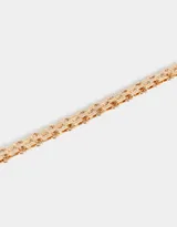 Pulsera dorada de eslabones gruesos con cierre de mosquetón y cadena de alargue.