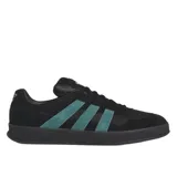 Championes Adidas Aloha Super negros con las tres tiras laterales en verde agua. Capellada de cuero y gamuza con suela de goma.