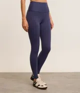 Calza legging deportiva azul marino de poliamida y elastano, con cintura alta de 10 cm y diseño liso.