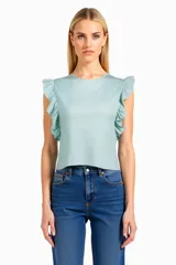 Remera de algodón entallada, color menta, con mangas fruncidas y corte a la cintura.