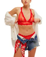 Bralette de malla transparente color celeste con ribete de encaje y espalda cruzada.