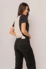Pantalón negro de lino de corte ancho con costuras a contratono.