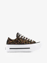 Championes Converse Chuck Taylor All Star Lift con estampado animal print en tonos marrón y negro. Plataforma blanca con línea negra.