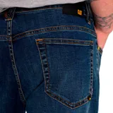 Pantalón de jean color verde militar, de corte slim, con cinco bolsillos y logo CAT en la parte trasera.