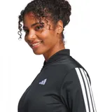 Conjunto deportivo Adidas Essentials de mujer, color negro con tres bandas blancas en mangas y piernas. Incluye campera con cierre y pantalón recto.