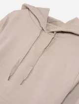 Hoodie de color rosa claro, con capucha y bolsillo frontal.