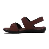 Sandalias marrones con ajuste de velcro en dos tiras y pulsera trasera.