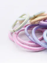 Pack de 18 coleros elásticos para el pelo, de colores pastel: celeste, lila, rosa, amarillo y naranja.