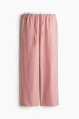 Pantalón de popelina de algodón a rayas rojas y blancas, con cintura elástica, cordón ajustable y bolsillos laterales.