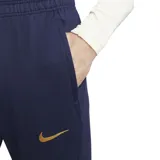 Pantalón de fútbol Nike del Paris Saint-Germain, modelo Strike. Diseño azul marino con detalles en dorado y patrón geométrico en la parte inferior de las piernas.