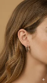 Aros colgantes plateados con forma de estrella.