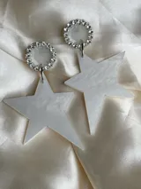 Aros colgantes con forma de estrella espejada, con base circular de strass.