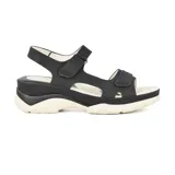 Sandalias negras con plataforma blanca y ajuste con velcro.