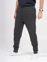 Pantalón babucha deportivo unisex azul, de tiro alto y con puños.