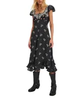 Vestido midi negro con estampado floral, escote cuadrado con detalles bordados y mangas cortas abullonadas.