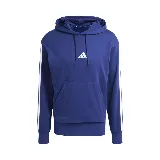 Buzo hoodie Adidas M 3S FT HD azul con capucha, bolsillo tipo canguro y logo de la marca bordado en el pecho. Presenta las tres tiras características de la marca en color blanco sobre las mangas.
