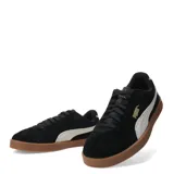 Championes Puma Club II Era Suede de mujer, color negro con franja lateral blanca y suela marrón.