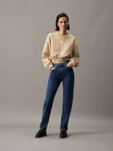 Buzo cropped de felpa en color beige, con cuello redondo y puños elásticos, decorado con insignia de Calvin Klein.