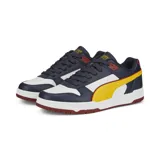 Championes Puma RBD Game Low, color azul marino con detalles en blanco, amarillo y rojo.