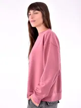 Buzo deportivo color rosa viejo, de corte holgado y mangas largas.