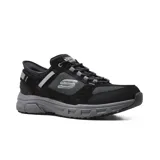 Championes Skechers Hands Free Slip-ins Relaxed Fit: Oak Canyon Consistent Winner para hombre, color negro con detalles en gris. Capellada de gamuza, material sintético y malla, con cordones elásticos. Plantilla Skechers Air-Cooled Memory Foam y suela flexible de alta tracción.