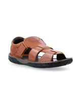Sandalias de cuero color marrón con múltiples tiras entrecruzadas y ajuste con velcro. Suela de goma negra.