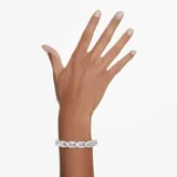 Brazalete rígido plateado con cristales blancos talla octogonal engarzados.