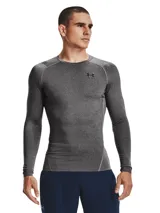 Remera de compresión Under Armour HeatGear Armour Comp LS, color gris jaspeado con detalles en gris liso en hombros y laterales.