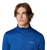 Remera de manga larga Columbia Three Pitch Half Zip color azul con paneles laterales en azul oscuro. Cuenta con tecnología Omni-Wick para mantenerte seco y fresco, costuras unidas para mayor comodidad, orificios para los pulgares en los puños, detalles reflectantes y cuello con media cremallera.