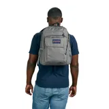 Mochila JanSport color gris con múltiples bolsillos y compartimentos, incluyendo funda interna para laptop de 15 pulgadas. Tiene una capacidad de 27 litros y un peso de 300 gramos.