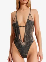 Malla entera Diesel modelo Daisy-Dnm con estampado abstracto en tonos negro y beige. Presenta escote en V pronunciado, espalda descubierta con tirantes finos y corte cavado.