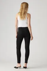 Jeans negros ajustados de tiro alto, con denim stretch y tecnología Hypersoft.