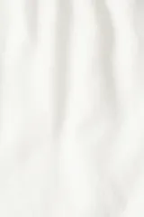 Pantalón blanco de lino con corte recto, cintura elástica y cordón ajustable.