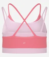 Top deportivo de microfibra color rosa con breteles finos y diseño de superposición bicolor.
