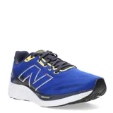 Championes New Balance Running Course, color azul con detalles en azul marino y amarillo.