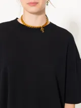 Sweater negro de lana merino y algodón, de mangas cortas y corte amplio.
