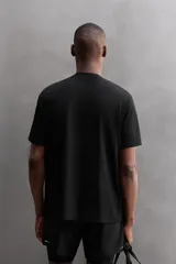 Camiseta blanca de corte holgado, cuello redondo y manga corta. Detalle de logo estampado en el bajo. Zara Athleticz.