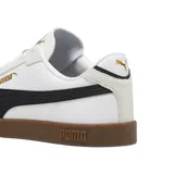 Championes Puma Club LI Era de cuero sintético negro con detalles en amarillo y suela color caramelo.