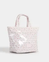 Lunchera tipo bolso con estampado escocés en tonos rosados y transparente. Tiene doble asa corta y etiqueta con logo en el frente.