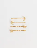 Set de cuatro horquillas doradas para el pelo, dos con apliques de luna y dos con apliques de estrella.