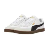 Championes Puma Club LI Era de cuero sintético negro con detalles en amarillo y suela color caramelo.